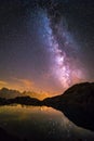 Milky Way and Starry Sky over Iconic Snowy Mont-Blanc Peaks Reflecting in Altitude Lake Royalty Free Stock Photo