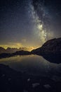 Milky Way and Starry Sky over Iconic Snowy Mont-Blanc Peaks Reflecting in Altitude Lake Royalty Free Stock Photo