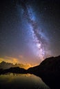 Milky Way and Starry Sky over Iconic Snowy Mont-Blanc Peaks Reflecting in Altitude Lake Royalty Free Stock Photo