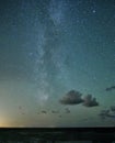 Milky way stars and clouds observing over sea