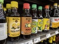 Mill Creek, WA USA - circa April 2022: Angled selective focus on bottles of ponzu sauce in the Asian food section of a Town and Royalty Free Stock Photo