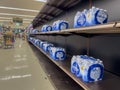 Mill Creek, WA USA - circa July 2022: View of low inventory of bottled water for sale inside a QFC grocery store