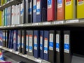 Mill Creek, WA USA - circa June 2022: Angled view of a variety of binders for sale inside a Staples store