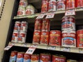 Mill Creek, WA USA - circa November 2022: Low angle view of canned tomatoes for sale inside a Sprouts Market