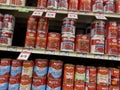 Mill Creek, WA USA - circa November 2022: Low angle view of canned tomatoes for sale inside a Sprouts Market