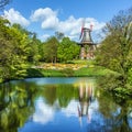 Mill in green park and lake, Bremen, Germany Royalty Free Stock Photo