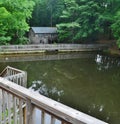 Mill pond near an old building.