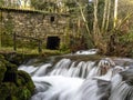 Mill with a river with silk water in the Molinos da Rocha ethnographic park. Arbo, Galicia, Spain.