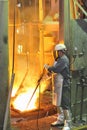 Mill worker with hot steel Royalty Free Stock Photo