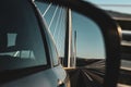 The millau viaduct from the highway in the mirror