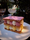 Mille-feuille raspberry chantilly dessert on a white plate Royalty Free Stock Photo