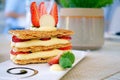Mille-feuille, that`s the French desserts, is a stack of pie crust, custard cream and fresh strawberry then topped with strawberry Royalty Free Stock Photo