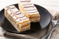 Millefoglie or French mille-feuille on white wood