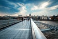 he Millenium Bridge and Saint Paul Cathedral on a stormy day in