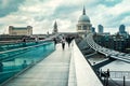 The Millenium Bridge and Saint Paul Cathedral on a typical rainy day in London Royalty Free Stock Photo