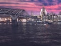 Millenium bridge and St.Pauls cathedral across the Thames river, London uk