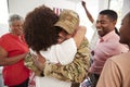 Millennial African American  soldier returning home embracing family members,close up Royalty Free Stock Photo