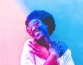 Millennial african woman smiling and wearing sunglasses - Black afro girl having fun in front of camera - Focus on face - Youth