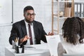 Millennial applicant answering HR manager`s questions during job interview at office Royalty Free Stock Photo