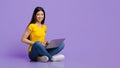 Millennial Asian Girl Sitting With Laptop Computer On Floor, Working Remotely