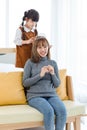 Millennial Asian happy cheerful little cute preschooler daughter girl role playing smiling standing wearing diamond princess crown Royalty Free Stock Photo