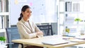 Millennial Asian happy cheerful pretty businesswoman secretary employee sitting smiling enjoy working online typing laptop Royalty Free Stock Photo