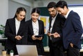 Millennial Asian Indian professional male businessmen female businesswomen employee staff colleagues in formal business suit Royalty Free Stock Photo