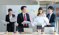 Millennial Asian young upset stressed male female businessmen businesswomen employee in formal suit working overload overtime with Royalty Free Stock Photo