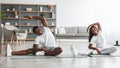 Young black couple doing side bend exercise together Royalty Free Stock Photo