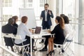 Male coach make whiteboard presentation for diverse employees Royalty Free Stock Photo