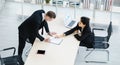 Millennial Caucasian successful thoughtful businessman and businesswoman colleague teamwork in formal suit sitting standing Royalty Free Stock Photo