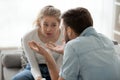 Mad millennial husband and wife arguing at home Royalty Free Stock Photo