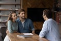 Millennial couple of clients meeting with real estate agent, realtor Royalty Free Stock Photo