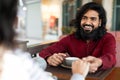 Millennial couple enjoying time together at coffee shop Royalty Free Stock Photo