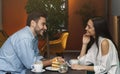 Millennial Couple In Love Talking Sitting In Coffee Shop