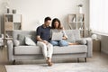 Millennial couple using Internet service, application on laptop Royalty Free Stock Photo