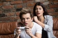 Millennial couple worried playing computer video game Royalty Free Stock Photo