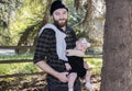 Millennial Dad with Baby in Carrier Outside Walking Royalty Free Stock Photo