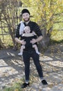 Millennial Dad with Baby in Carrier Outside Walking Royalty Free Stock Photo