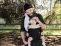 Millennial Dad with Baby in Carrier Outside Walking Royalty Free Stock Photo