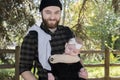 Millennial Dad with Baby in Carrier Outside Walking Royalty Free Stock Photo