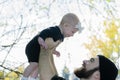 Millennial Dad Holding Baby Daughter Up Showing Affection Royalty Free Stock Photo