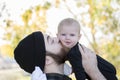 Millennial Dad Holding Baby Daughter Up Showing Affection Royalty Free Stock Photo