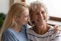 Millennial daughter showing support and care to senior mother Royalty Free Stock Photo