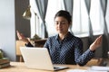 Millennial ethnic woman meditate at workplace at home Royalty Free Stock Photo