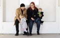 Millennial Father and Mother with Two Young Children, Dressed in Warm Winter Clothes Royalty Free Stock Photo