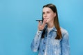 Millennial female holding phone speak activate virtual digital voice assistant on smartphone, girl recording voice message Royalty Free Stock Photo