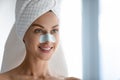 Millennial female using cleansing pores nose strips