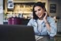 Millennial girl sits at a laptop and studies remotely. The student uses online distance learning opportunities.