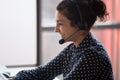 Millennial happy indian call center worker consulting client. Royalty Free Stock Photo